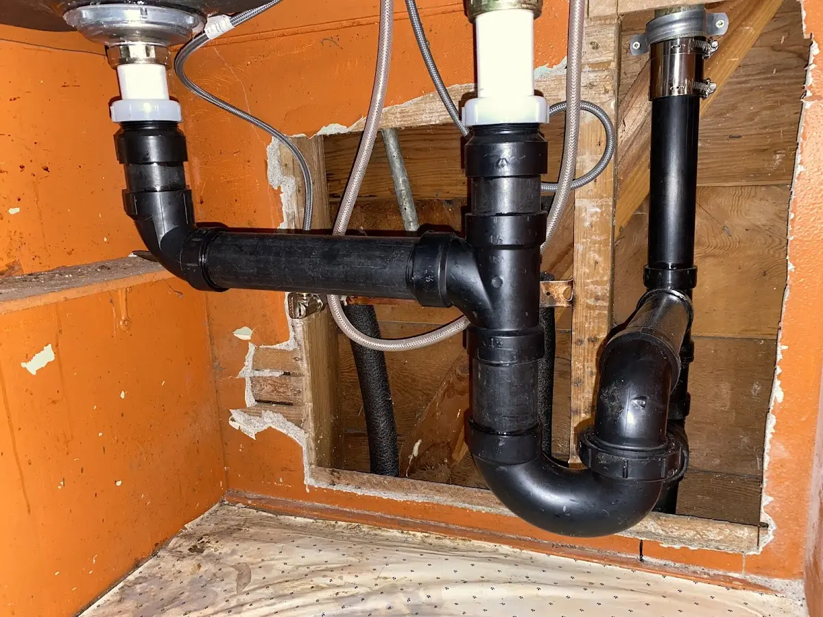 Professional Garbage Disposal Repair equipment and tools on the job in Sunset Beach